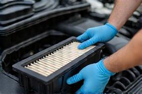 Mechanic replacing air filter