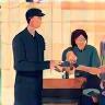 Happy customer receiving car keys from mechanic